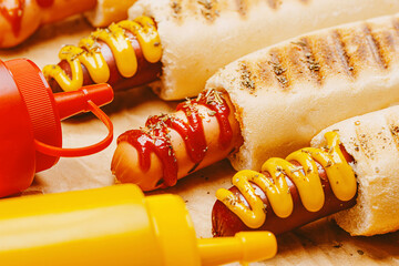 classic American hot dog with mustard and ketchup close-up
