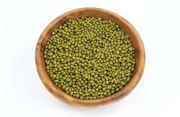 The legumes of the mung green and oval shape in a round bowl on a white background