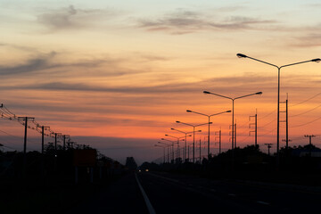 Fototapeta na wymiar Electricity road sunset energy supply of town