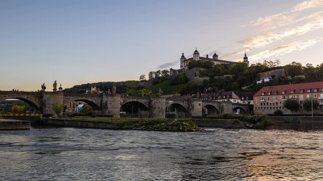 Day to Night Timelapse from W&uuml;rzburg in Bayern, Germany with the Fortress Marienberg behind and the old Main Bridge