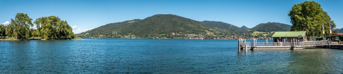 Fototapeta na wymiar Lake Tegernsee - Bavaria - Germany, panoramic summer view across the famous lake from Bad Wiessee to Tegernsee city and St Quirin (Gmund)