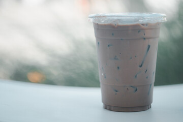Iced coffee in disposable plastic cup