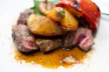 Delicious and juicy beef steak on white dish