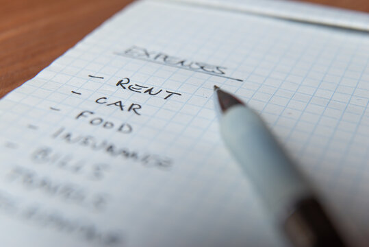 List of daily living expenses, with a pen next to it.