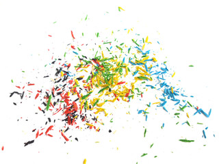Colorful pencil fragments, tiny pencil shavings on white background. Crayon shavings Artistic abstract background for celebrations and parties. Creative pattern design.
