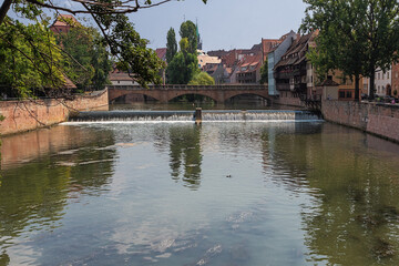 Walking over the Pegnitz River in Nuremberg near the Haller Gate Bridge