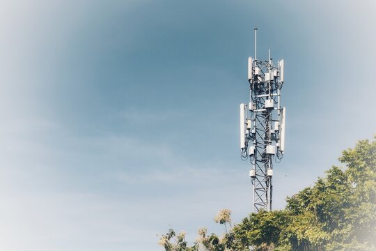 Telecommunications antennas, radio and satellite communication technology, telecommunications industry Mobile network or telecommunications 4g 5g separated from the blue background