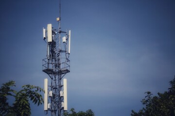 Telecommunications antennas, radio and satellite communication technology, telecommunications industry Mobile network or telecommunications 4g 5g separated from the blue background