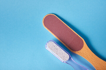 wooden foot grater and plastic pumice stone with foot brush