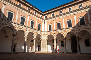 Fototapeta na wymiar Panoramic view of the renaissance courtyard of the Ducal Palace in Urbino, Italy.