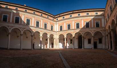 Fototapeta na wymiar Panoramic view of the renaissance courtyard of the Ducal Palace in Urbino, Italy.