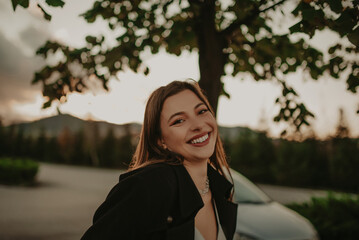 Young model woman with perfect and sexy body looking at camera posing outdoor