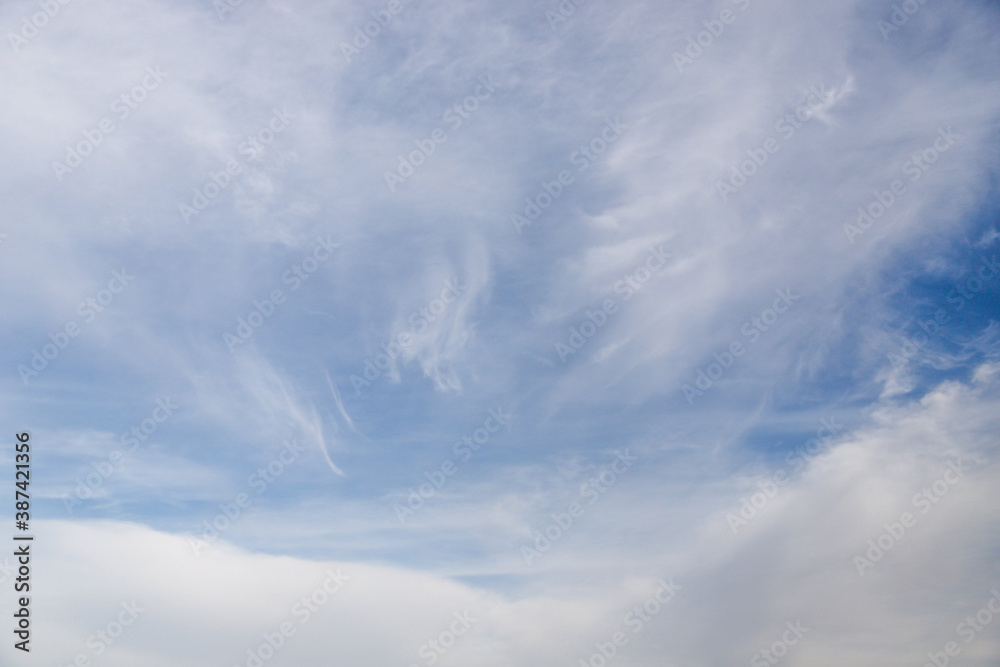 Wall mural Cirrocumulus clouds in the light blue sky background