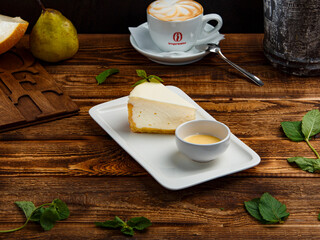 cheesecake with dessert sauce on a plate