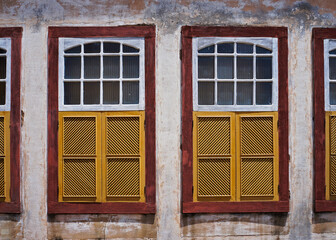 Ancient colonial windows in historical city of Ouro Preto, Brazil 