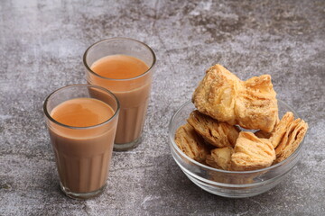 indian khari or kharee or salty Puff Pastry Snacks, served with indian hot tea.