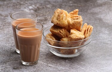 indian khari or kharee or salty Puff Pastry Snacks, served with indian hot tea.