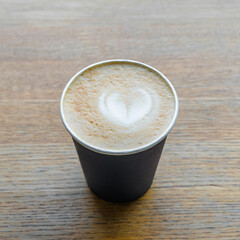 Cup of coffee on wood background, stock photo