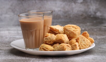 indian khari or kharee or salty Puff Pastry Snacks, served with indian hot tea.