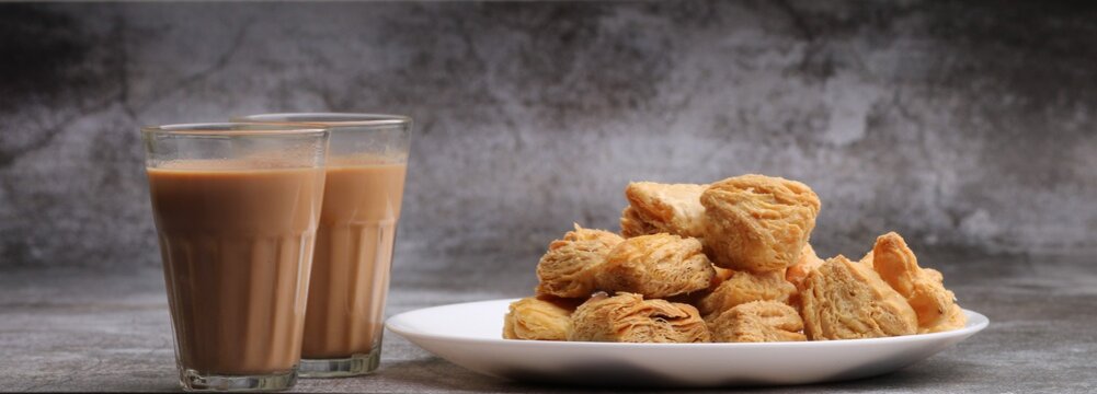 indian khari or kharee or salty Puff Pastry Snacks, served with indian hot tea.