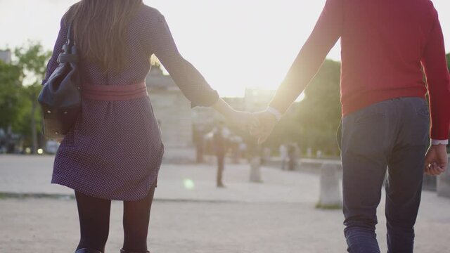 Couple walking holding hands in Paris 4k PRORES Footage