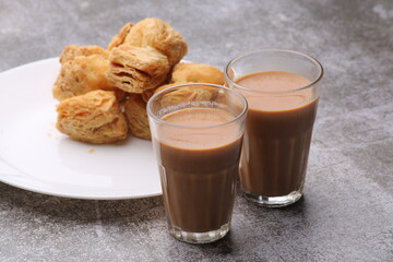 indian khari or kharee or salty Puff Pastry Snacks, served with indian hot tea.