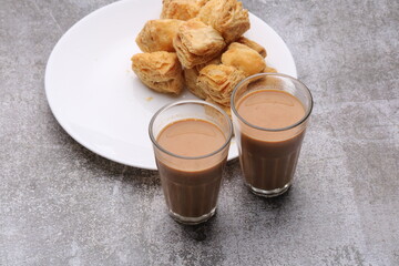 indian khari or kharee or salty Puff Pastry Snacks, served with indian hot tea.