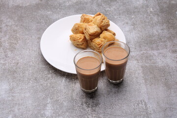 indian khari or kharee or salty Puff Pastry Snacks, served with indian hot tea.