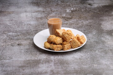 indian khari or kharee or salty Puff Pastry Snacks, served with indian hot tea.