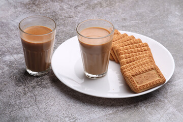 Cutting Chai, Traditional Desi Roadside tea of india with biscuits.