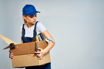 Working woman box with tools courier delivery work