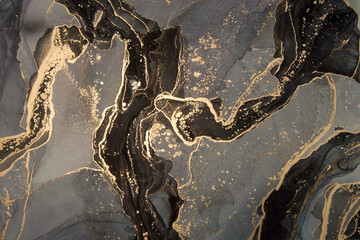 Luxury abstract fluid art painting in alcohol ink technique, mixture of black and gold paints. Imitation of marble stone cut, glowing golden veins. Tender and dreamy design - obrazy, fototapety, plakaty