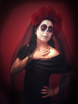 Mexican girl disguised as a Catrina on the Day of the Dead festival