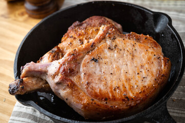 pan fried pork chop in skillet pan