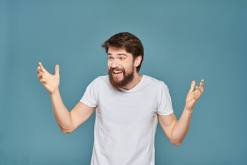 man in white t-shirt gesturing with his hands studio cropped