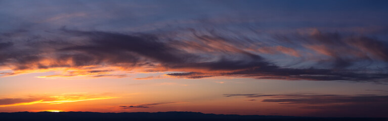 Backgrounds and textures. Beautiful and dramatic colorful sky with clouds at sunset. Sky texture. Abstract nature background.