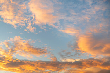 Beautiful colorful bright sunset sky with orange clouds. Nature sky background.