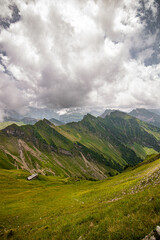Fototapeta premium Landscape with Swiss Alps mountains and green nature. Photo taken at Fluebrig.