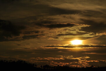 Sunset view with beautiful golden sky,the colorful sky lights in the evening