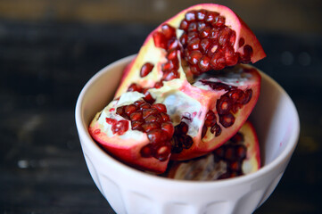 Ripe red pomegranates. Seasonal fruits. Royal fruit.