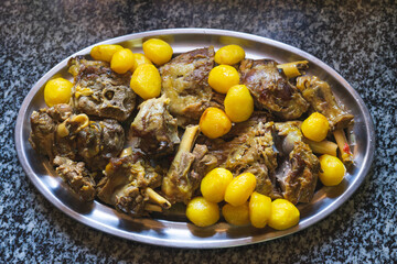 Tray of stewed meat with potatoes.