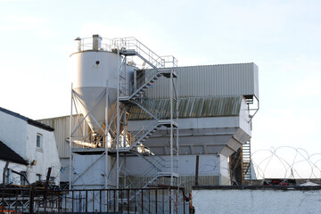 External View of Factory with Steel Silo- Stairway & Buildings 