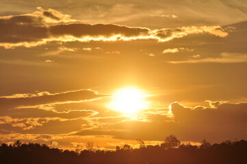 Sunset view with beautiful golden sky,the colorful sky lights in the evening	