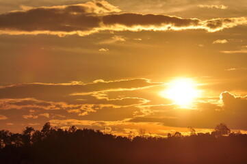 Sunset view with beautiful golden sky,the colorful sky lights in the evening	