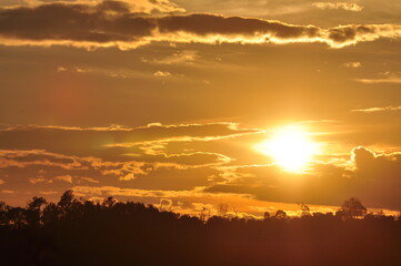 Sunset view with beautiful golden sky,the colorful sky lights in the evening	
