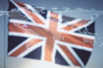 Double exposure of abstract digital world map on British flag and blue sky background, research and strategy concept
