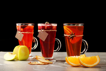 set of tea in mulled. autumn traditional drinks with fruit, set punch and mulled wine on christmas. isolated on black