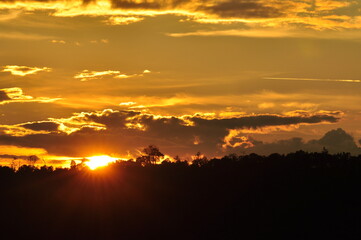 Sunset view with beautiful golden sky,the colorful sky lights in the evening