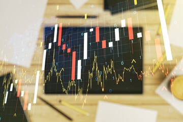 Multi exposure of abstract creative financial graph with world map and modern digital tablet on background, top view, forex and investment concept