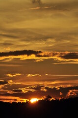 Sunset view with beautiful golden sky,the colorful sky lights in the evening
